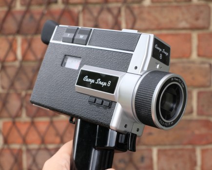 Photograph of the Camp Snap CS8 digital video camera, showing logo, handle and lens.
