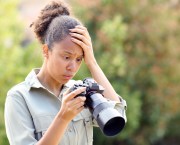 Worried photographer is unhappy with image on the camera. Pheelings Media, Getty Images