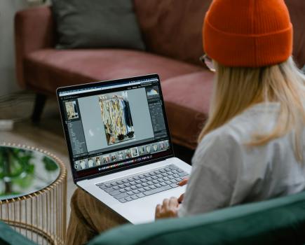 Woman using photo editing software to edit a picture